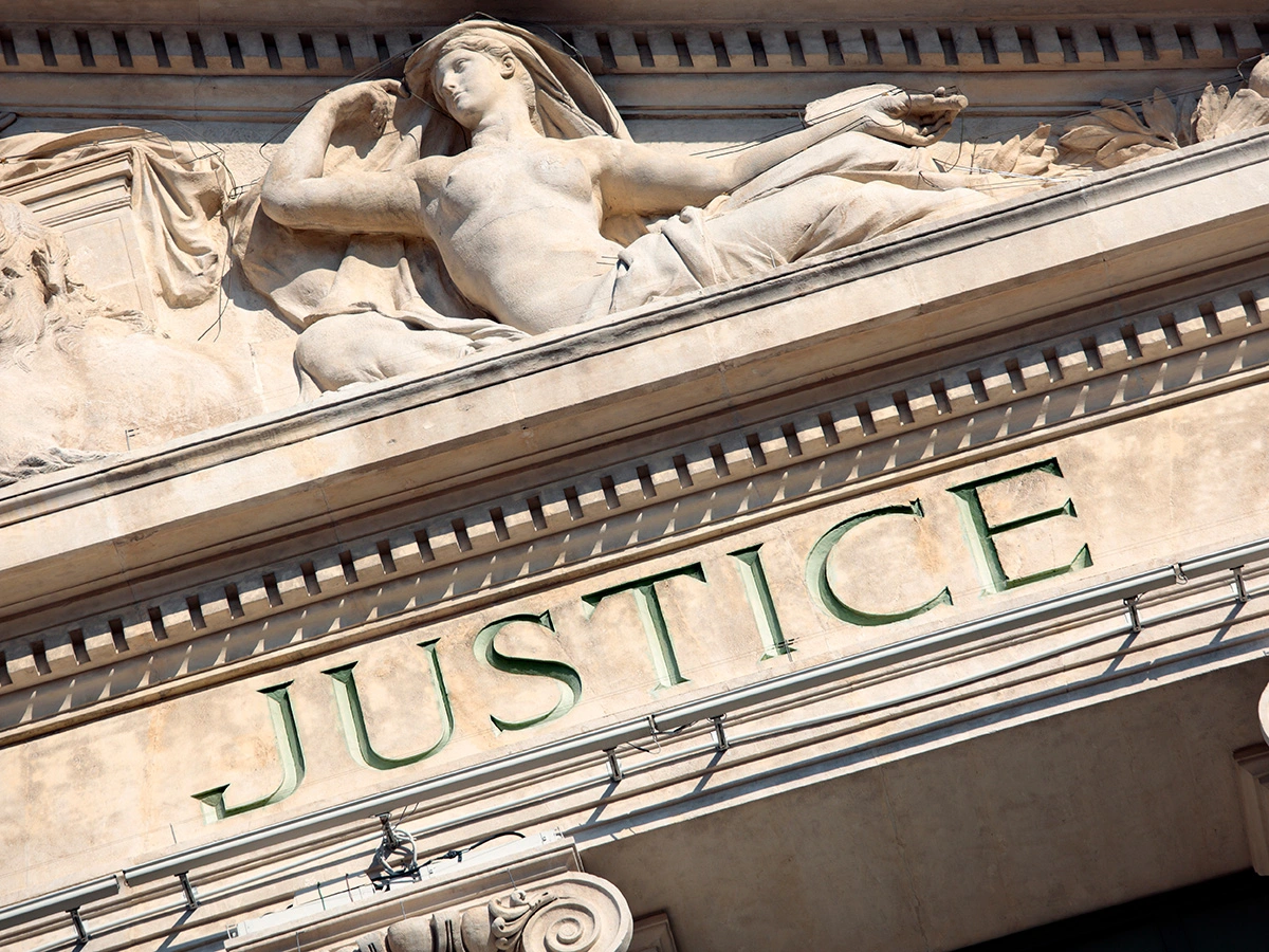 photo of a justice building statue | administrative law at Williams and Weyand